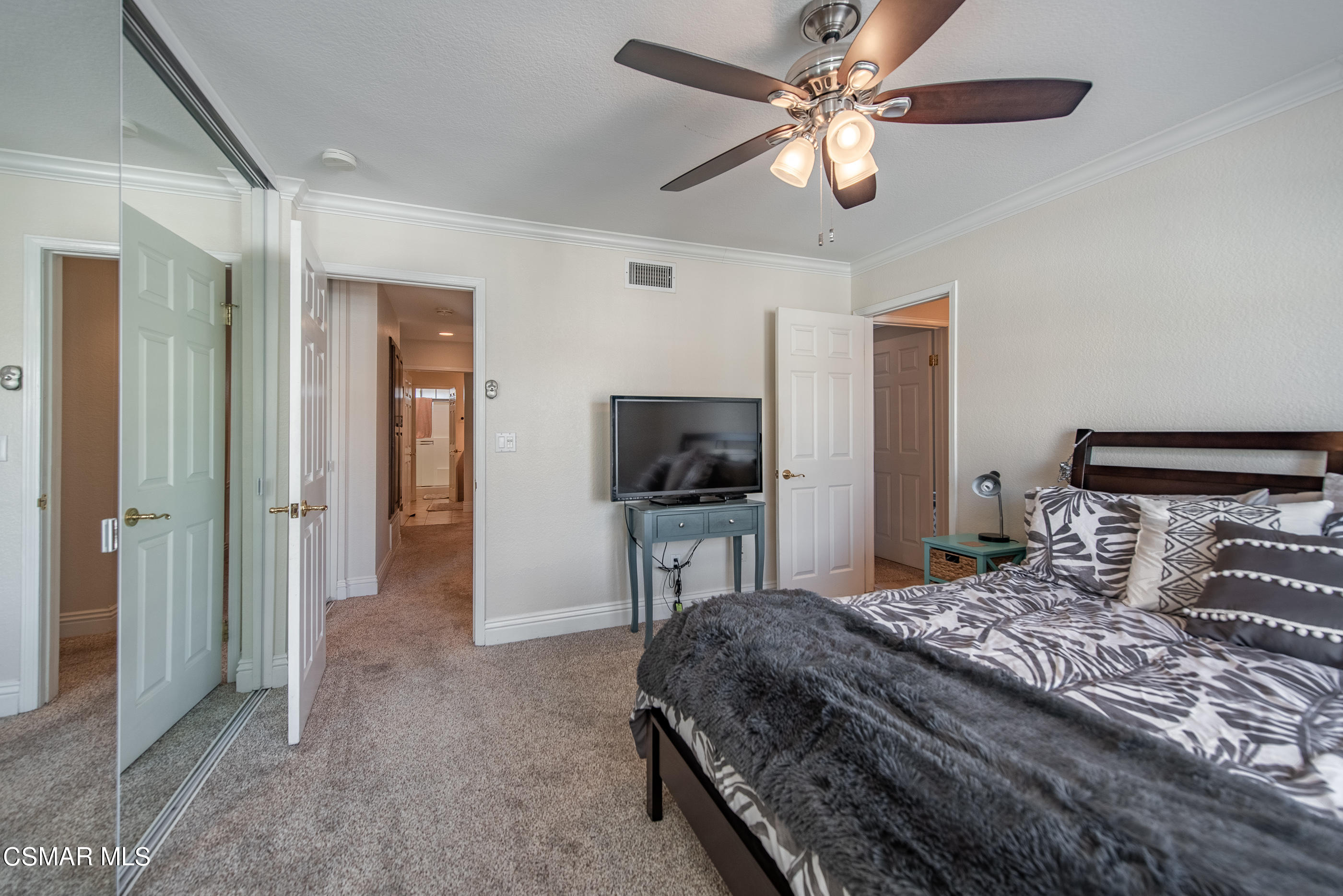 1940 Rory Lane, Unit 3 Simi Valley, CA 93063 - Photo 17 of 33 a bedroom with a bed and a flat screen tv