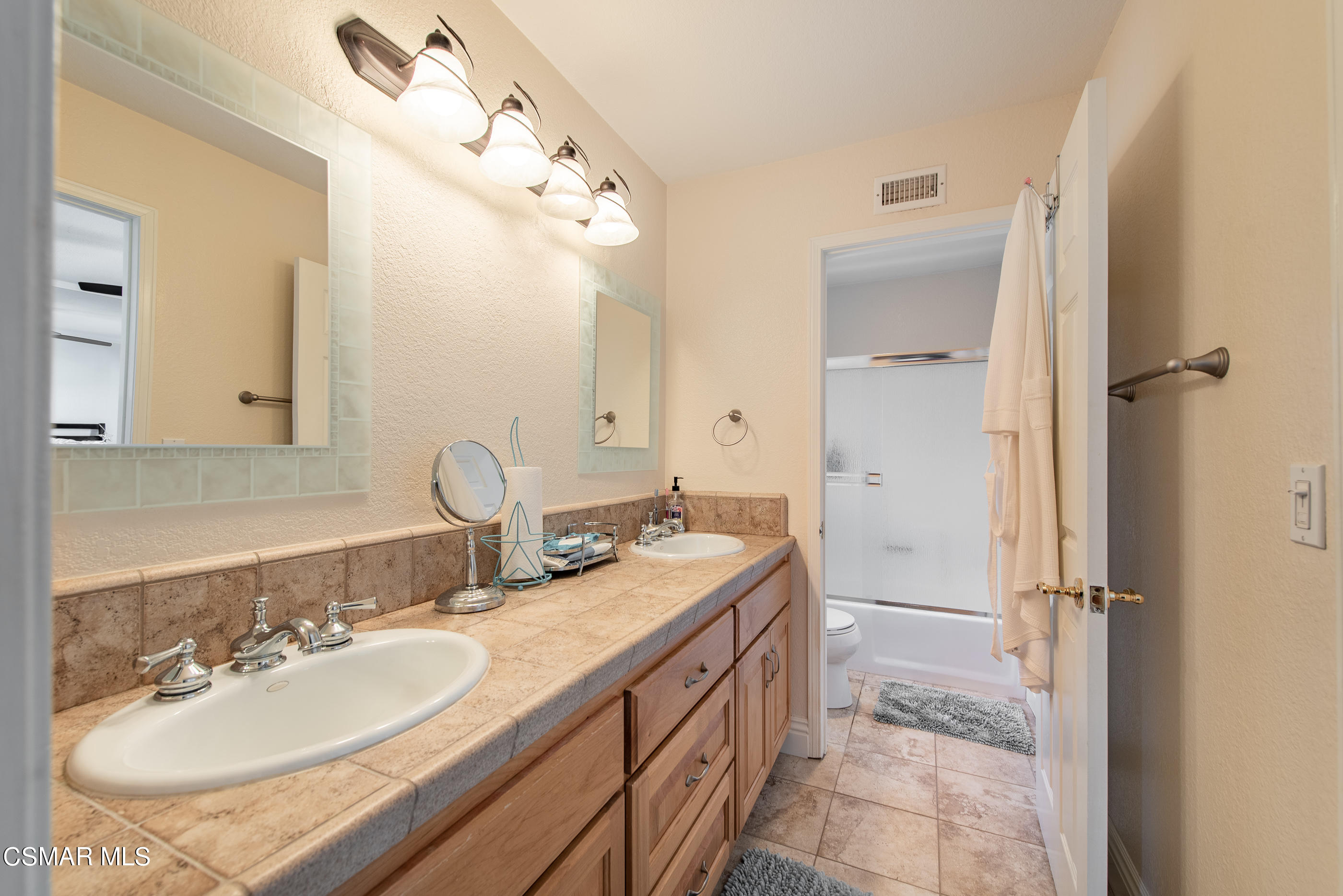 1940 Rory Lane, Unit 3 Simi Valley, CA 93063 - Photo 18 of 33 a spacious bathroom with a double vanity sink mirror and shower