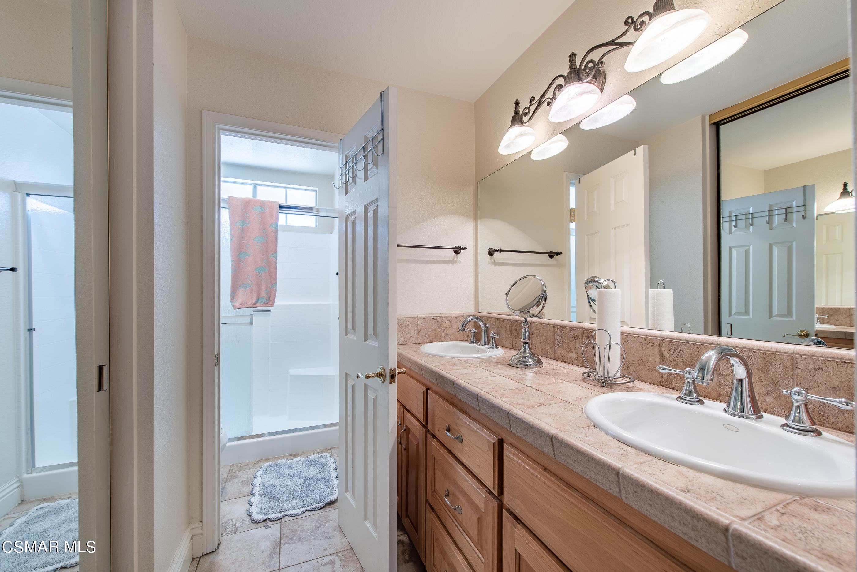 1940 Rory Lane, Unit 3 Simi Valley, CA 93063 - Photo 22 of 33 a bathroom with a granite countertop sink a toilet and shower