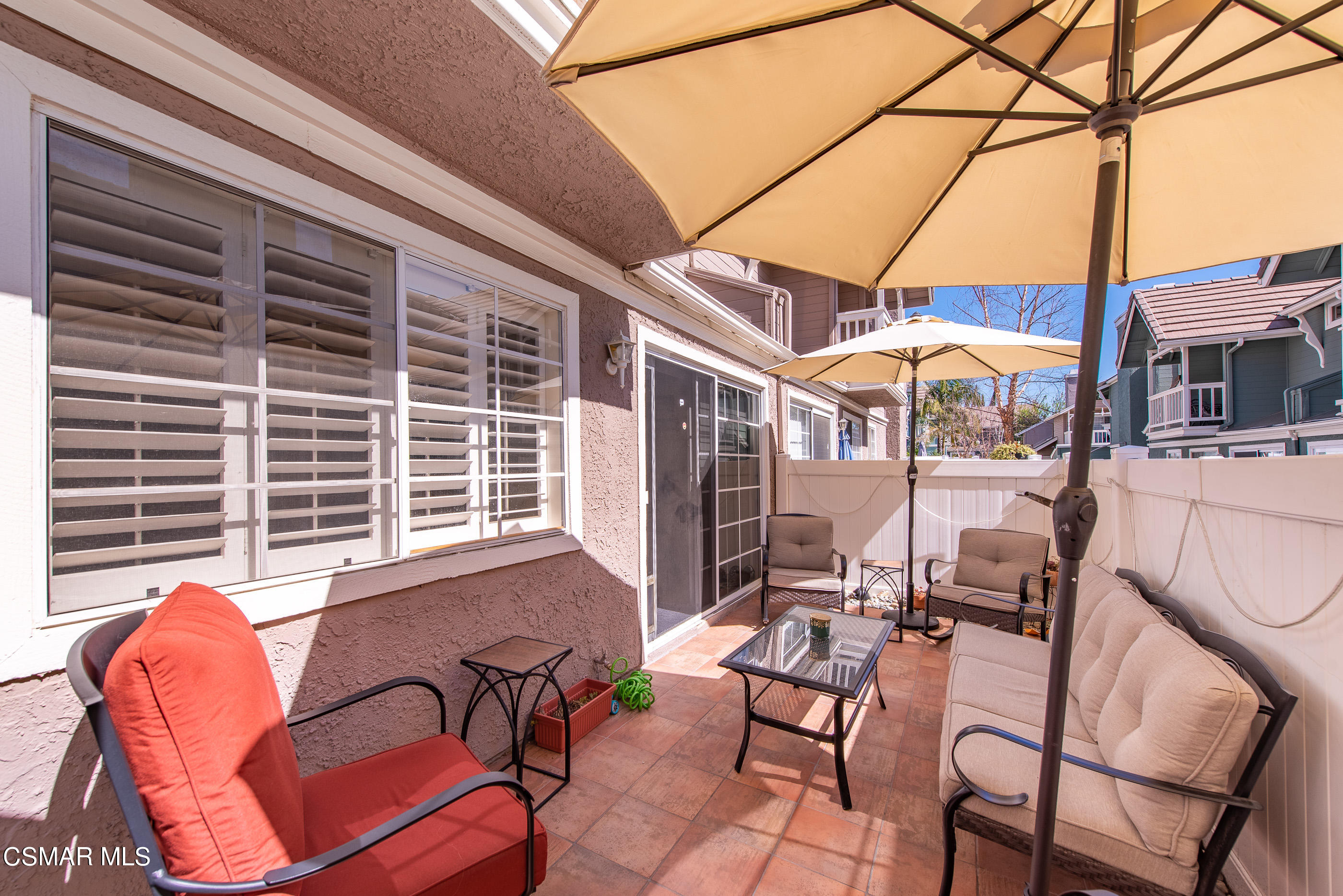 1940 Rory Lane, Unit 3 Simi Valley, CA 93063 - Photo 26 of 33 a view of a patio with a table and chairs
