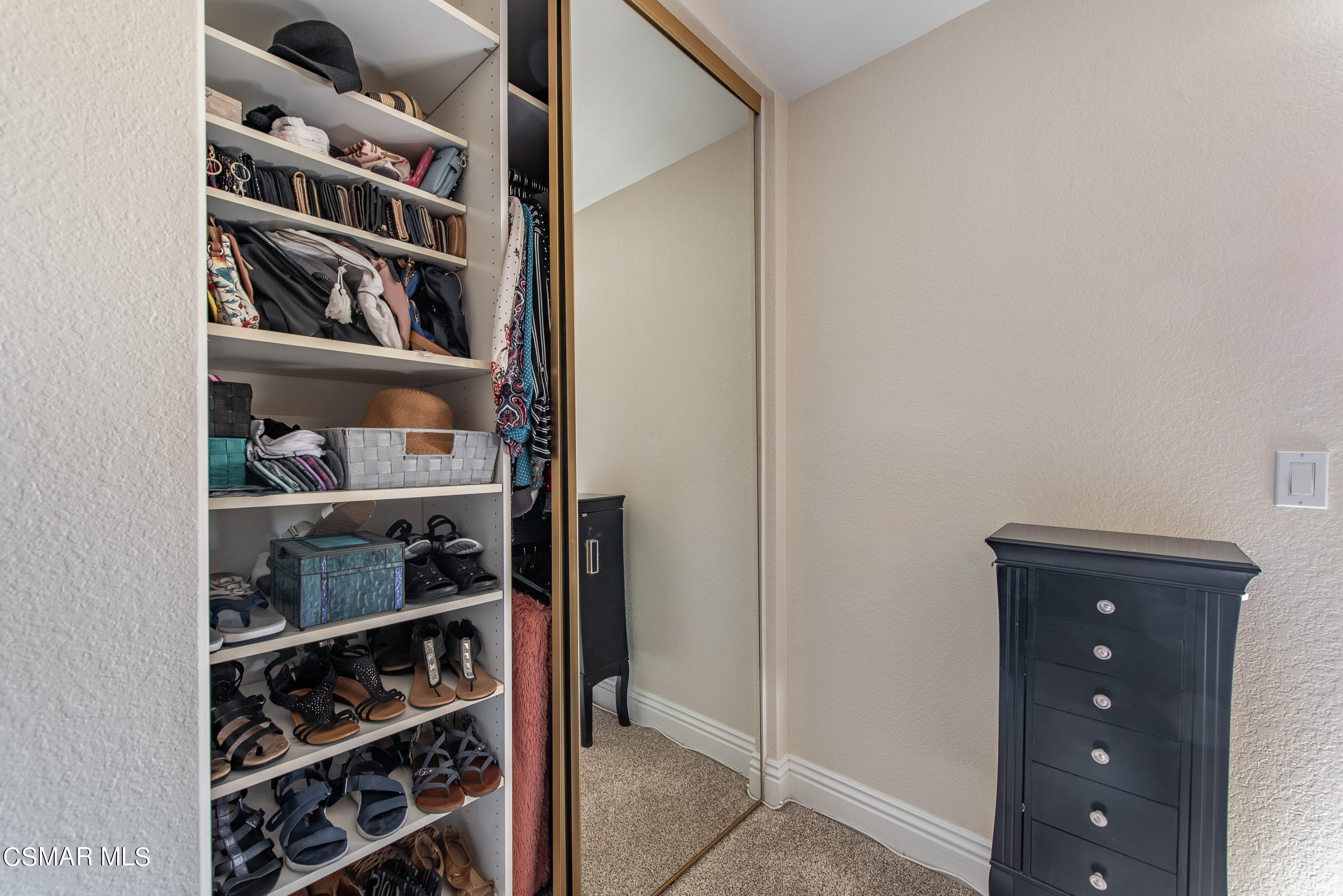 1940 Rory Lane, Unit 3 Simi Valley, CA 93063 - Photo 30 of 33 a view of walk in closet with clothes and shoes