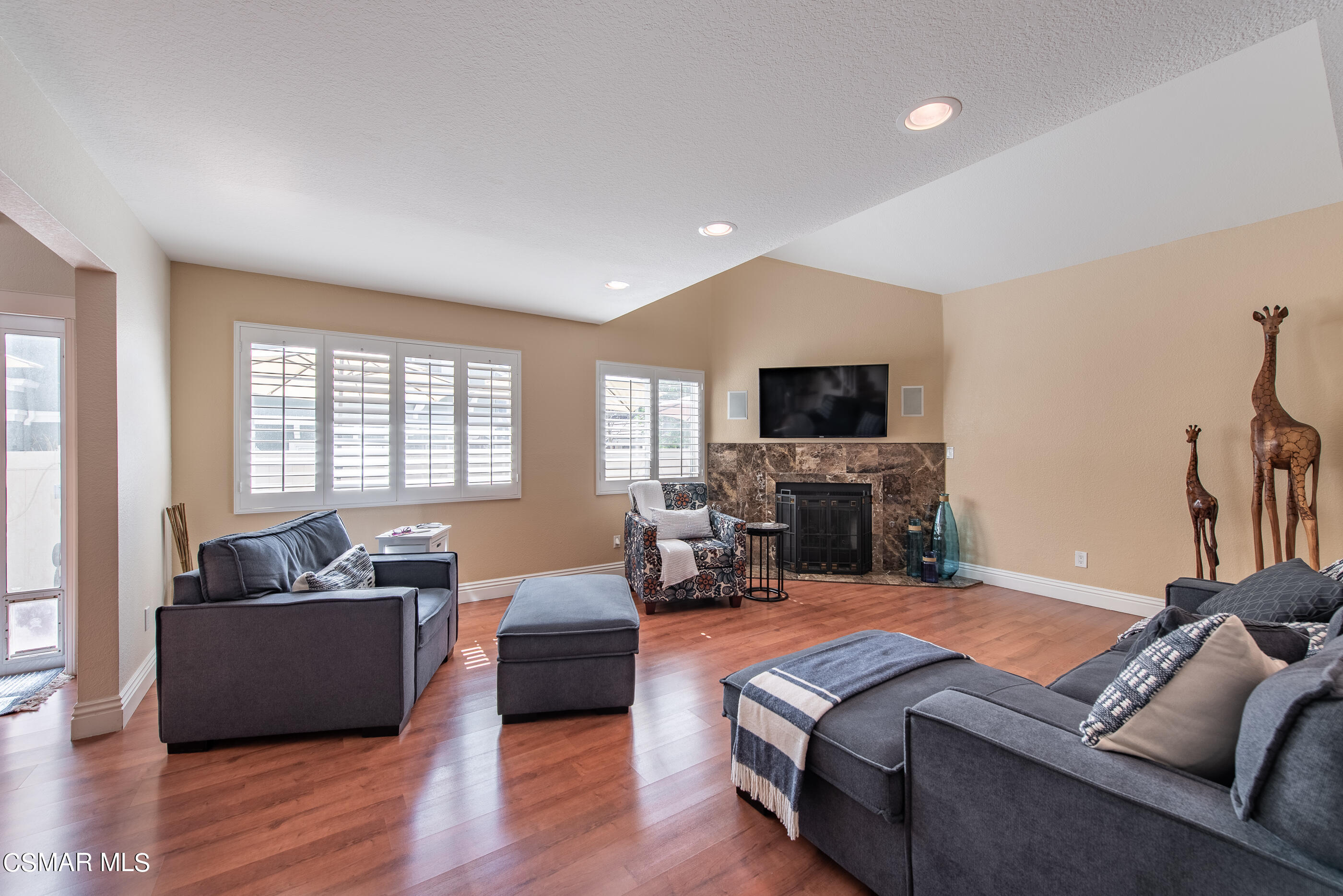 1940 Rory Lane, Unit 3 Simi Valley, CA 93063 - Photo 5 of 33 a living room with furniture flat screen tv and a fireplace