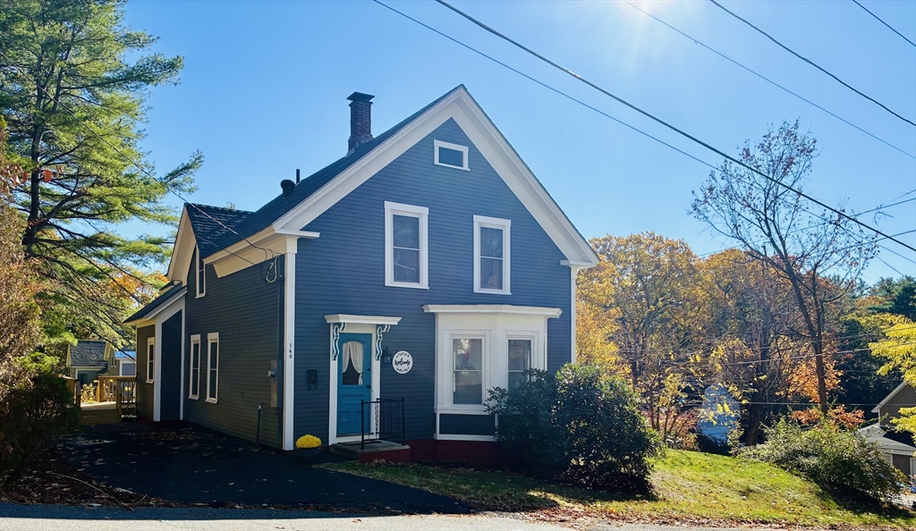 a front view of a house with garden