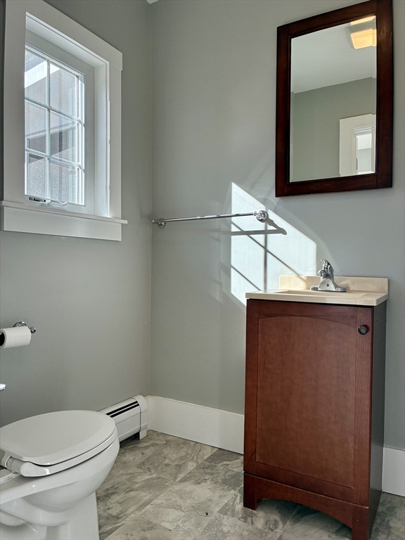 140 Mechanic Street Orange, MA 01364 - Photo 14 of 39 a bathroom with a toilet sink and mirror