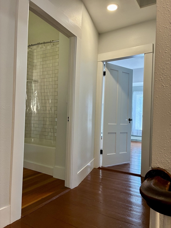 140 Mechanic Street Orange, MA 01364 - Photo 15 of 39 a view of an empty room with wooden floor and a bathroom