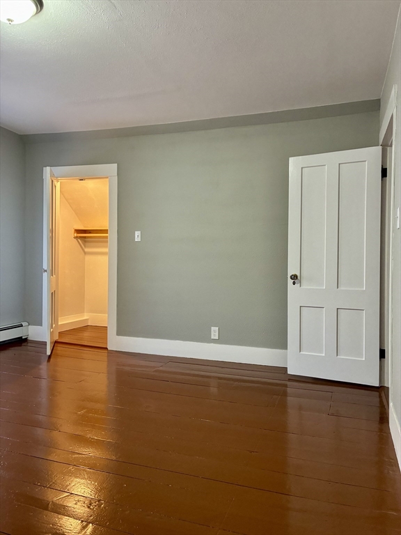 140 Mechanic Street Orange, MA 01364 - Photo 16 of 39 an empty room with wooden floor and closet