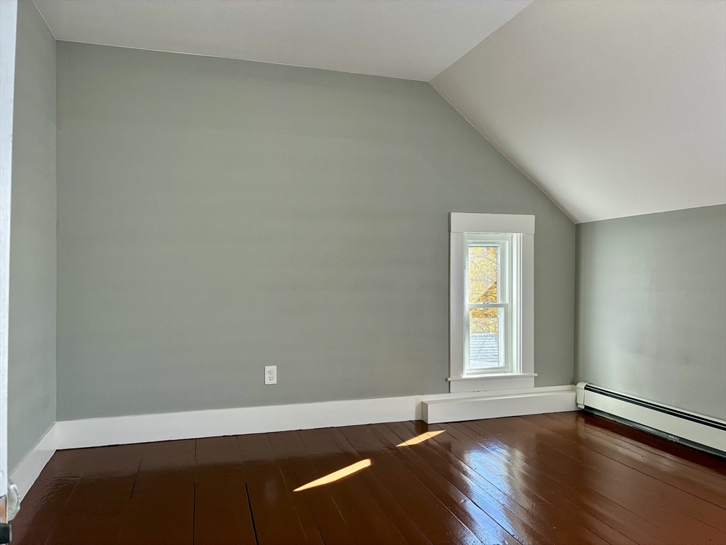 140 Mechanic Street Orange, MA 01364 - Photo 17 of 39 an empty room with wooden floor and windows