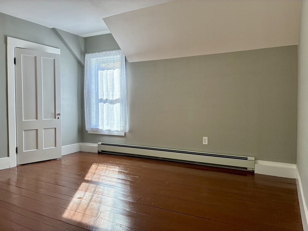 140 Mechanic Street Orange, MA 01364 - Photo 20 of 39 an empty room with wooden floor and windows
