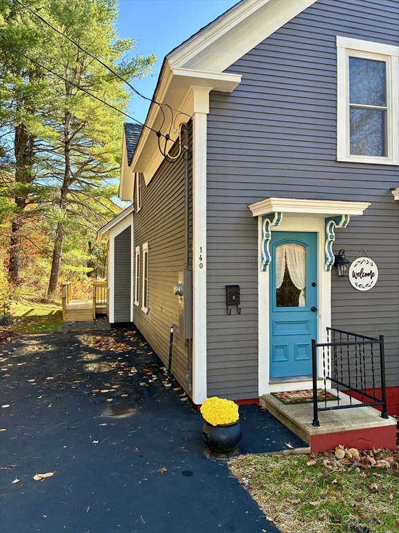 140 Mechanic Street Orange, MA 01364 - Photo 2 of 39 a view of a house with wooden fence
