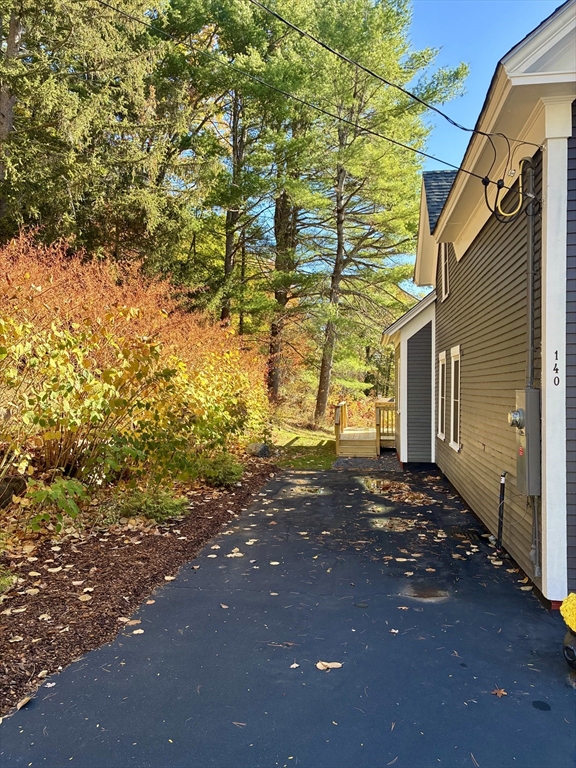 140 Mechanic Street Orange, MA 01364 - Photo 28 of 39 a view of a house with a yard