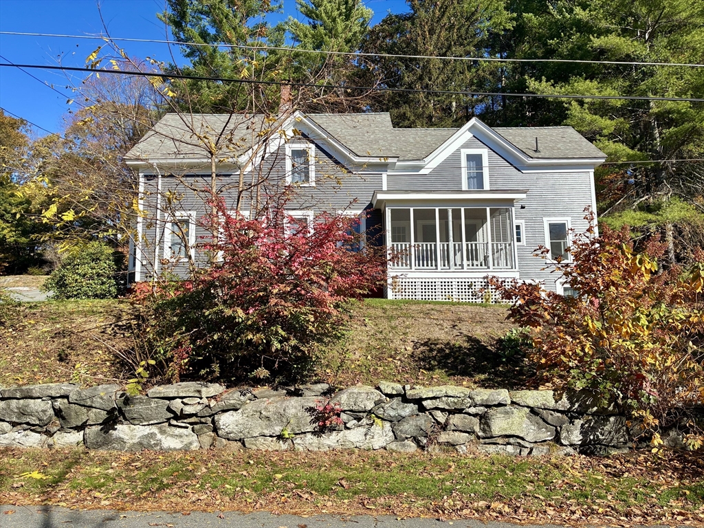 140 Mechanic Street Orange, MA 01364 - Photo 30 of 39 a front view of a house with a yard and potted plants