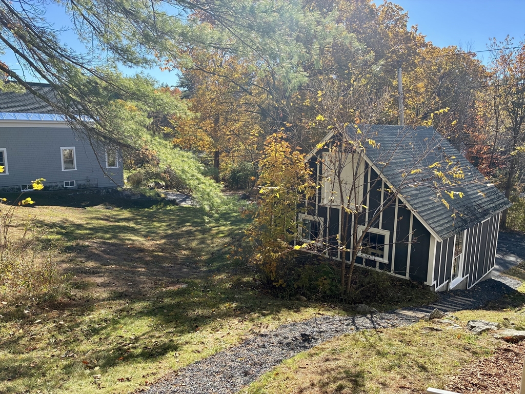 140 Mechanic Street Orange, MA 01364 - Photo 36 of 39 a view of a house with a yard covered with snow
