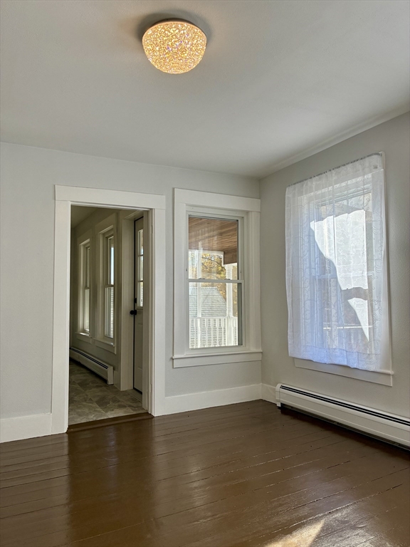 140 Mechanic Street Orange, MA 01364 - Photo 5 of 39 an empty room with wooden floor and windows