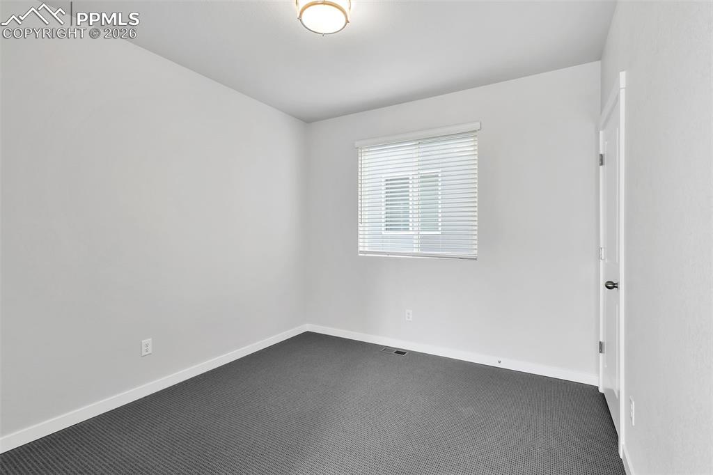 13641 Frost Bitten Grove Colorado Springs, CO 80921 - Photo 12 of 13 an empty room with a window