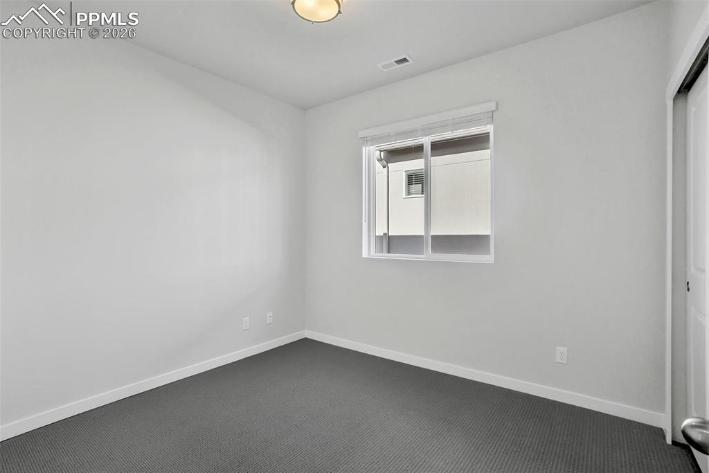 13641 Frost Bitten Grove Colorado Springs, CO 80921 - Photo 3 of 13 an empty room with a window