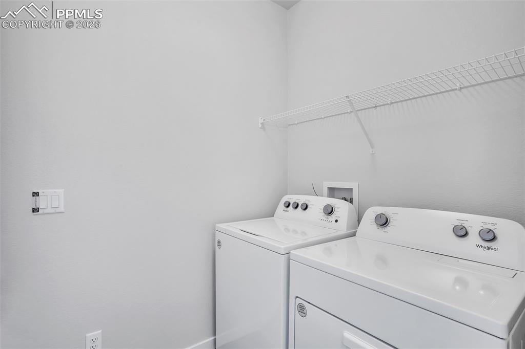 13641 Frost Bitten Grove Colorado Springs, CO 80921 - Photo 7 of 13 a utility room with dryer and washer