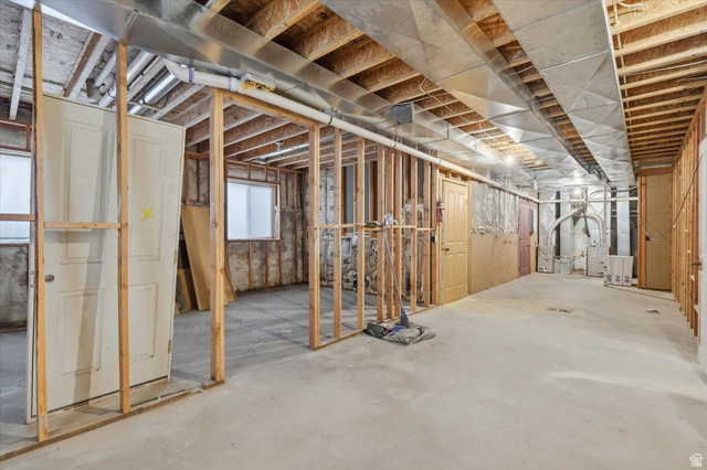 560 East 700 North Logan, UT 84321 - Photo 23 of 32 Unfinished basement with concrete flooring, exposed wood framing, and visible ductwork