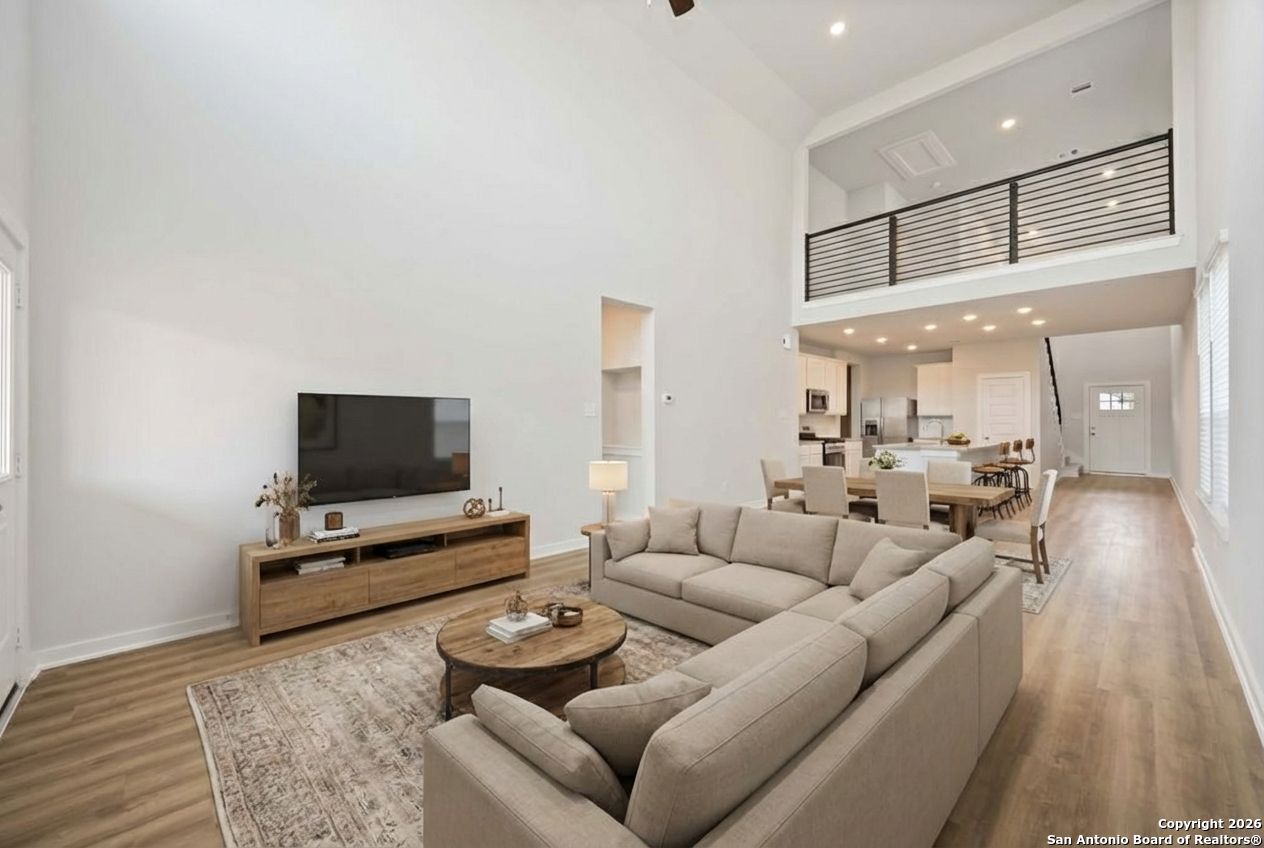 16447 Ginger Crossing Elmendorf, TX 78112 - Photo 3 of 6 a living room with furniture and a flat screen tv