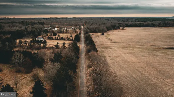 a view of outdoor space with deck and yard