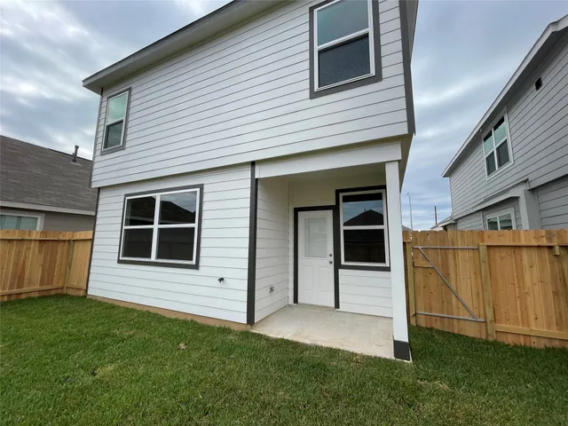 a view of a yard in front of a house with a yard