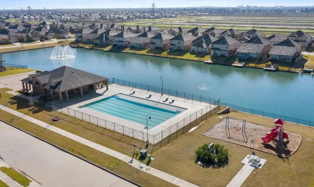 an aerial view of a house with a lake view