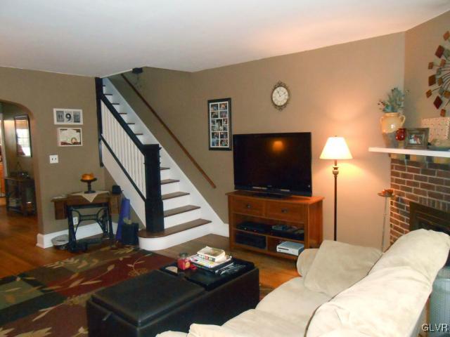 725 Spring Street Bethlehem, PA 18018 - Photo 4 of 21 a living room with furniture and a flat screen tv