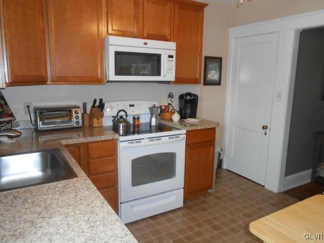 725 Spring Street Bethlehem, PA 18018 - Photo 8 of 21 a kitchen with a stove and a microwave
