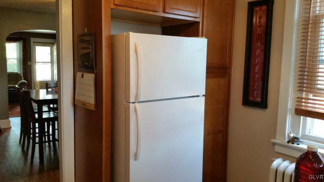 725 Spring Street Bethlehem, PA 18018 - Photo 9 of 21 a white refrigerator freezer sitting in a kitchen