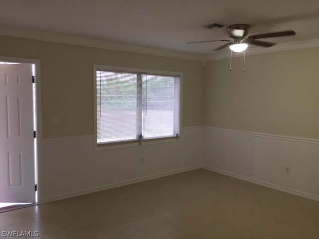 205 Delaware Road Lehigh Acres, FL 33936 - Photo 8 of 14 an empty room with a window