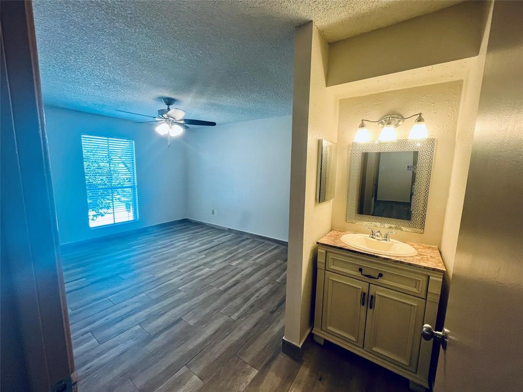 1516 Bay Area Boulevard, Unit 14 Houston, TX 77058 - Photo 15 of 19 wooden floor in an empty room with a mirror