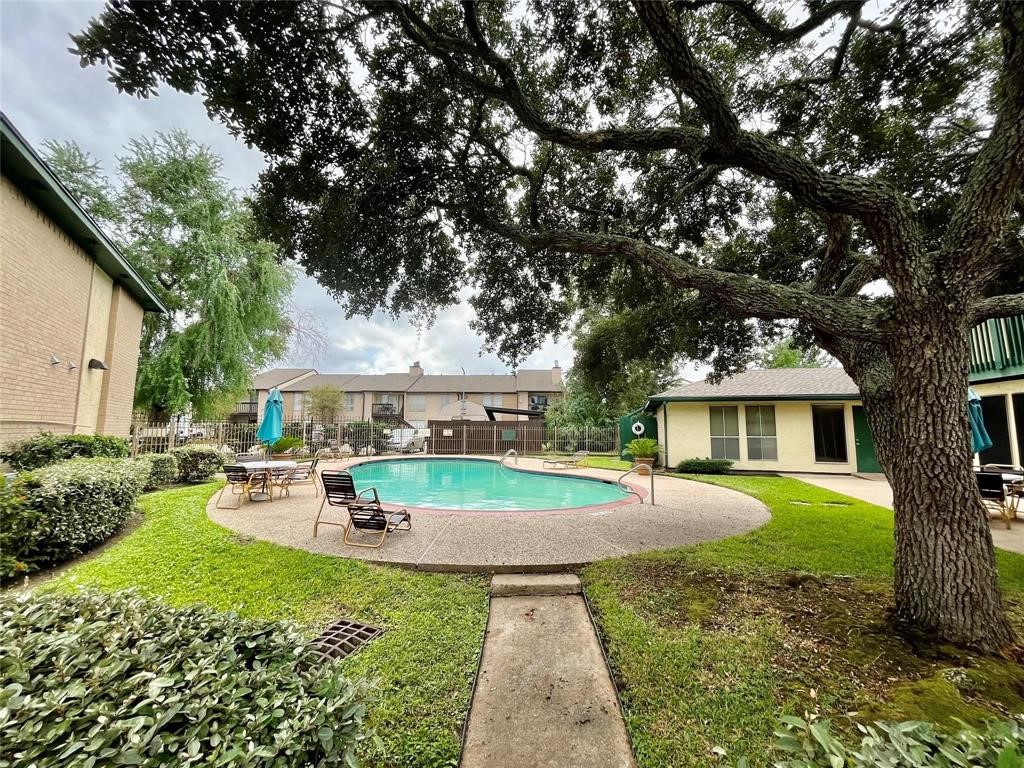 1516 Bay Area Boulevard, Unit 14 Houston, TX 77058 - Photo 3 of 19 a view of a house with a backyard