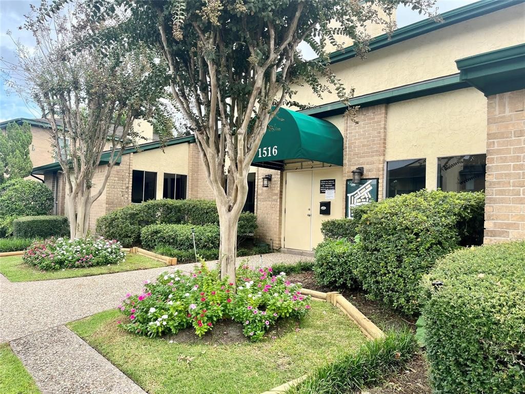 1516 Bay Area Boulevard, Unit 14 Houston, TX 77058 - Photo 4 of 19 a front view of a house with a yard