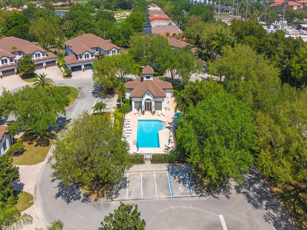 4415 Dover Court, Unit 504 Naples, FL 34105 - Photo 16 of 21 an aerial view of multiple houses with yard