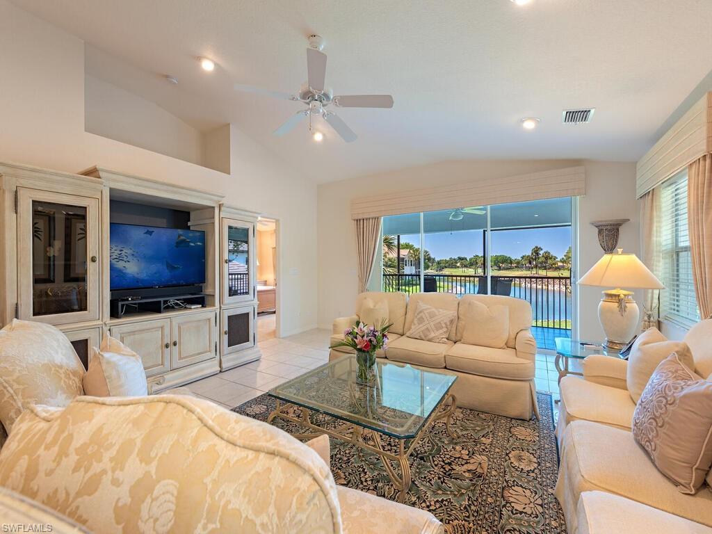 4415 Dover Court, Unit 504 Naples, FL 34105 - Photo 2 of 21 a living room with furniture and a flat screen tv