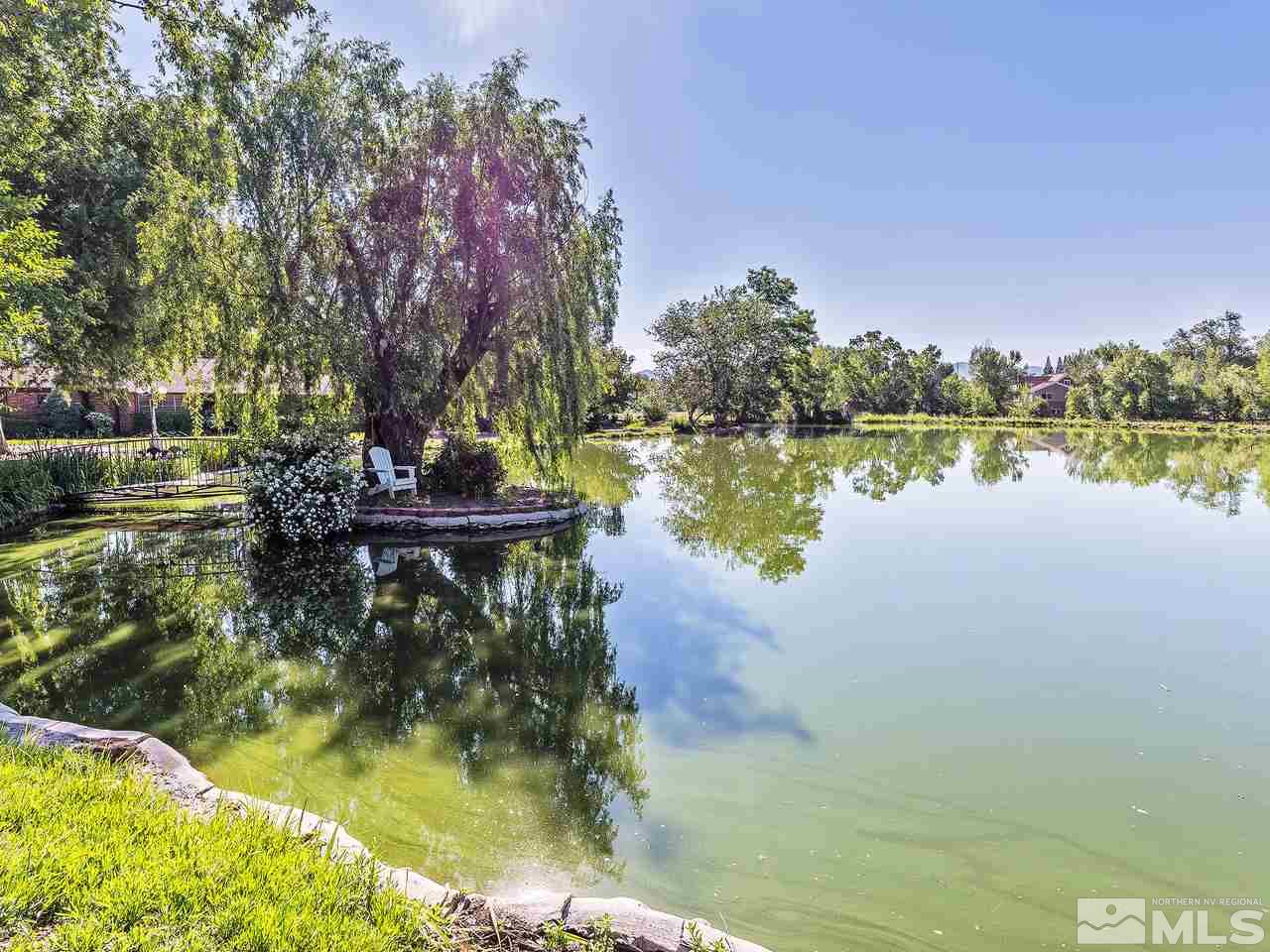 2855 Holcomb Ranch Lane Reno, NV 89511 - Photo 3 of 36 a view of a lake with houses