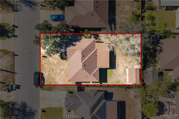 an aerial view of houses with outdoor space