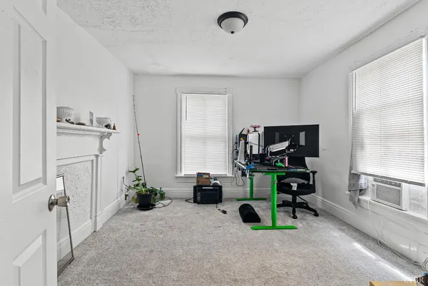 a view of a livingroom with furniture and a flat screen tv