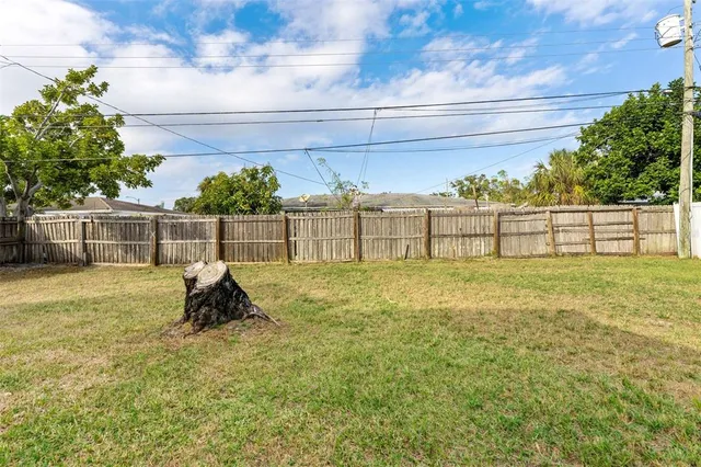a view of outdoor space with deck and yard