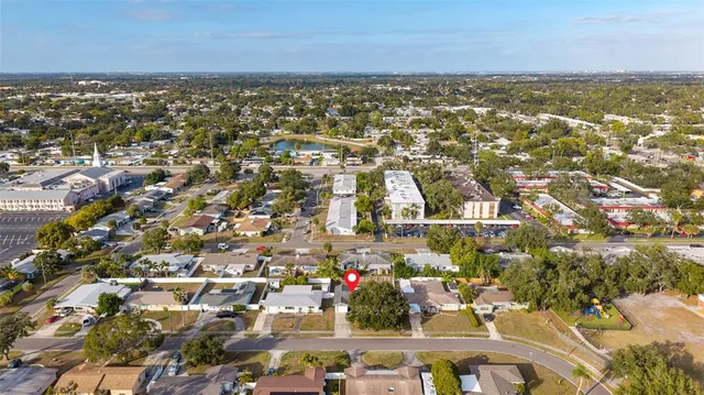 an aerial view of residential building and ocean