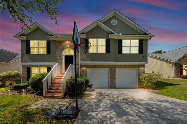 a front view of a house with garden