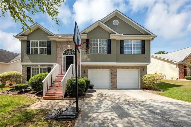 a front view of a house with garden