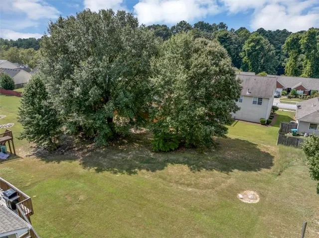 an aerial view of residential house with outdoor space