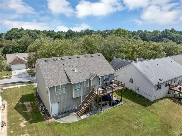 an aerial view of a house with a garden