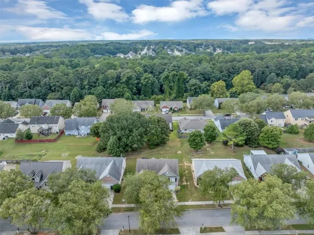 an aerial view of a houses with outdoor space and street view