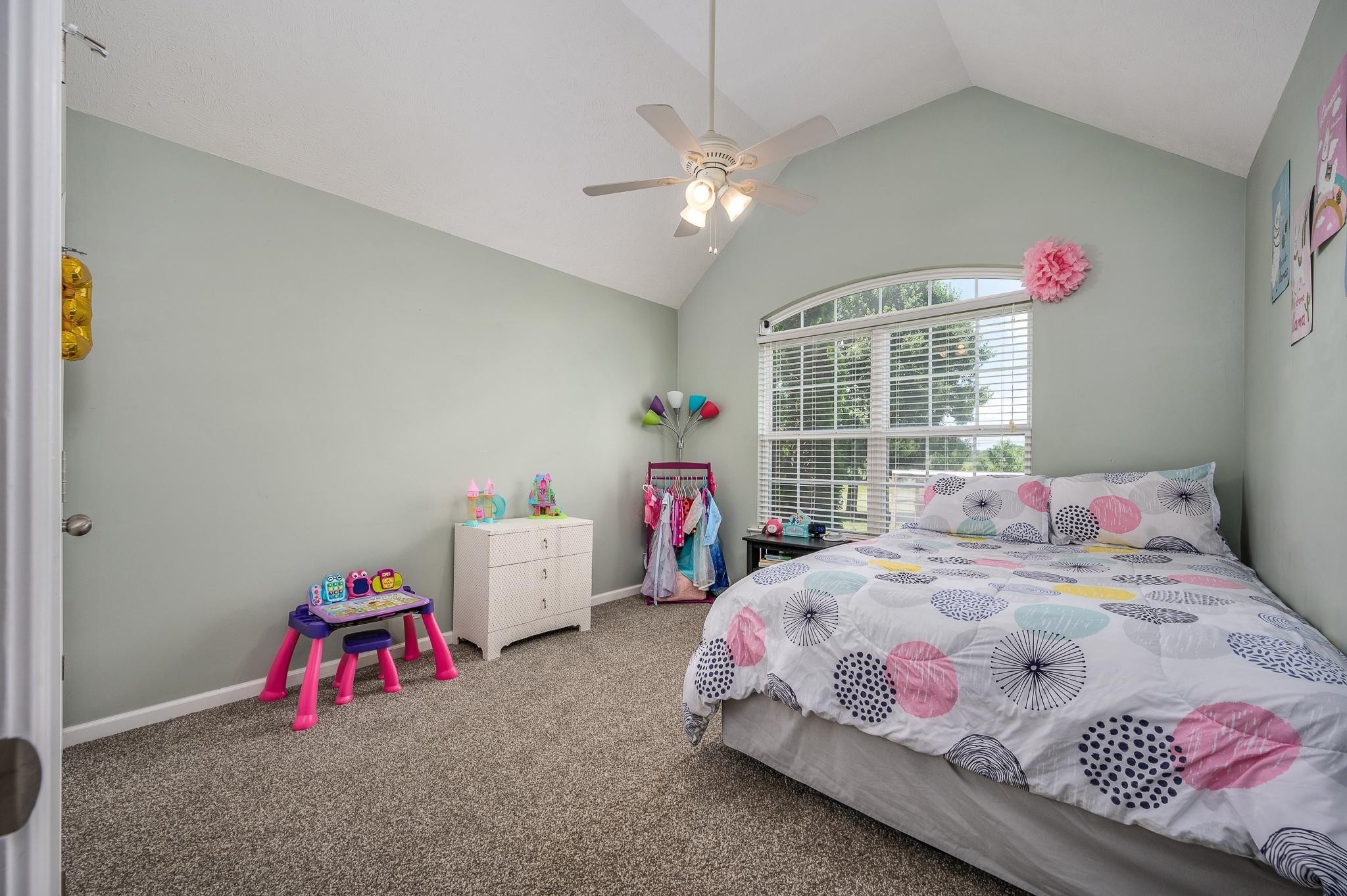 5039 Midland Fosterville Road Bell Buckle, TN 37020 - Photo 17 of 32 a bedroom with bed and a chandelier
