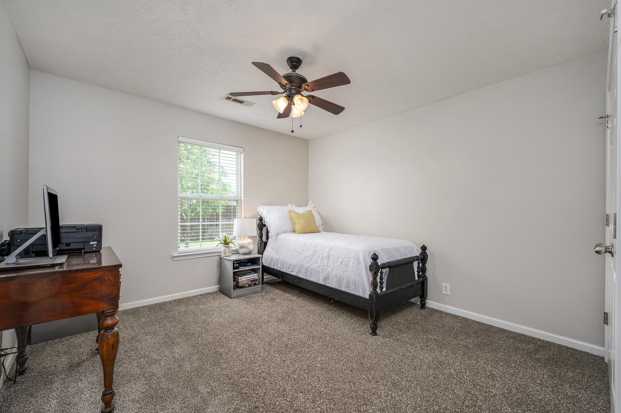 5039 Midland Fosterville Road Bell Buckle, TN 37020 - Photo 19 of 32 a bedroom with a bed and a window