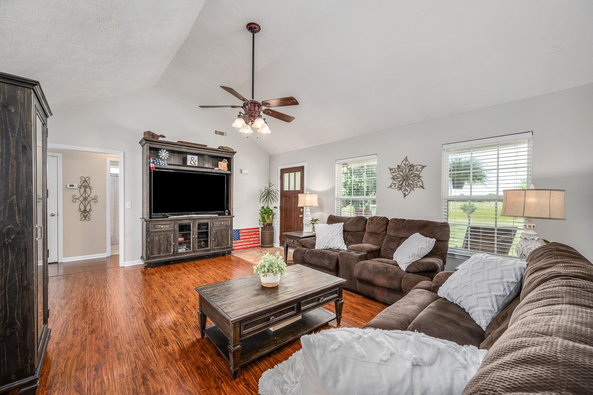 5039 Midland Fosterville Road Bell Buckle, TN 37020 - Photo 6 of 32 a living room with furniture and a flat screen tv