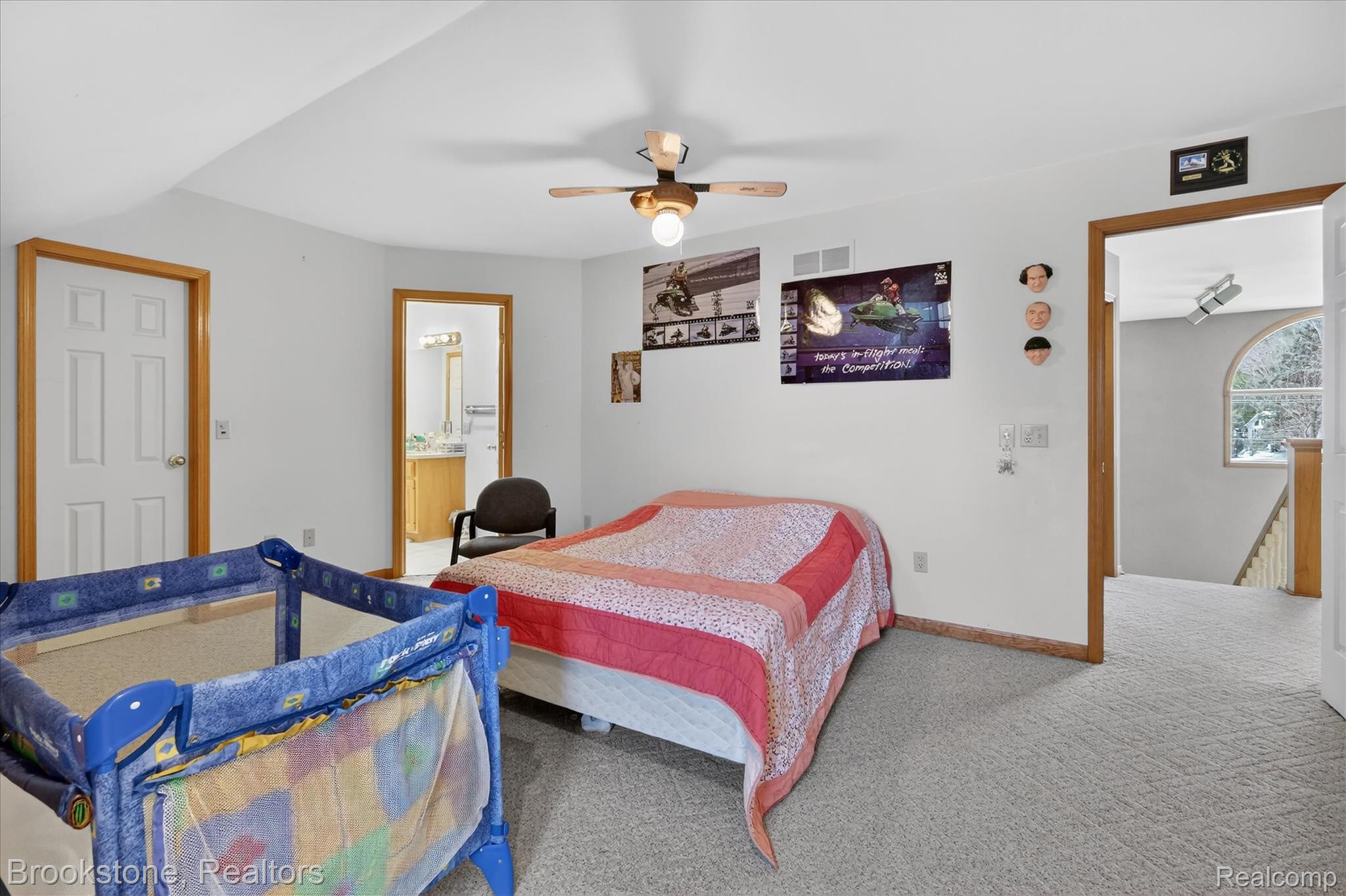 5163 Country Squire Road Dryden, MI 48428 - Photo 39 of 64 Carpeted bedroom with ensuite bath and a ceiling fan