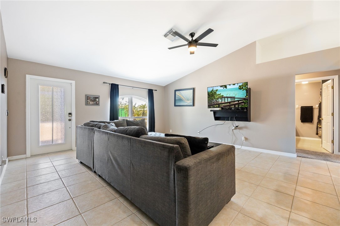 217 Manatee Street Fort Myers, FL 33913 - Photo 12 of 39 a living room with furniture and a flat screen tv