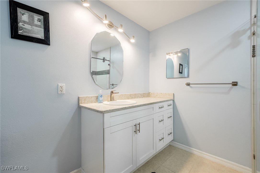217 Manatee Street Fort Myers, FL 33913 - Photo 20 of 39 a bathroom with a sink and a mirror